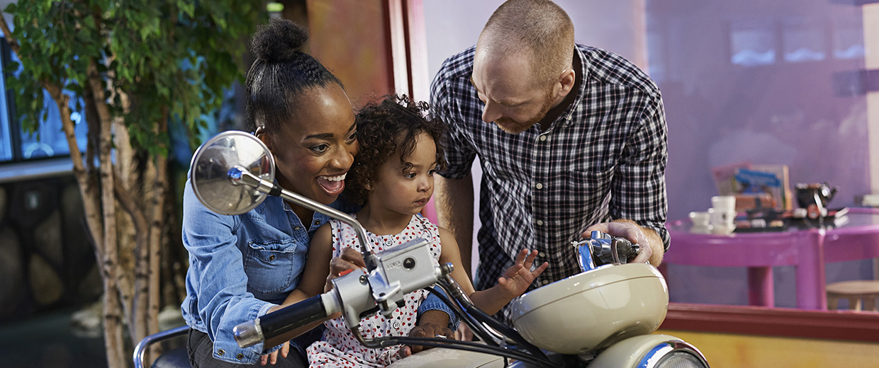 A man and woman on a motorcycle in Ottawa.